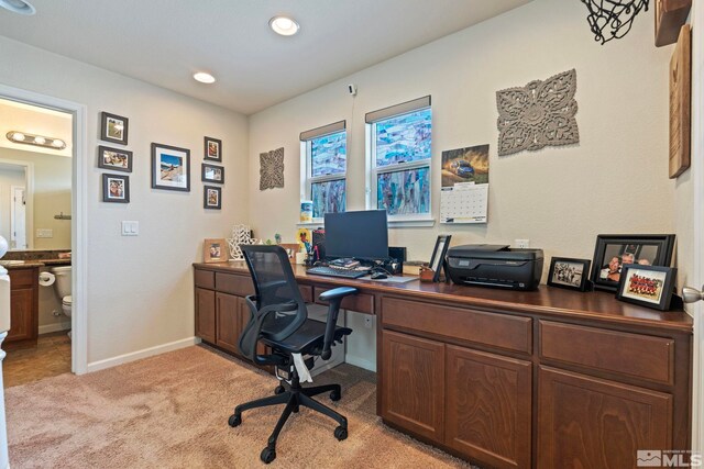office space featuring recessed lighting, light colored carpet, and baseboards