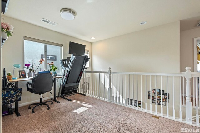 carpeted office space with recessed lighting and visible vents