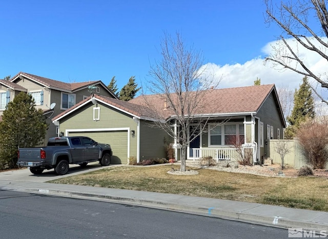 view of front of property featuring fence, a porch, a front yard, a garage, and driveway