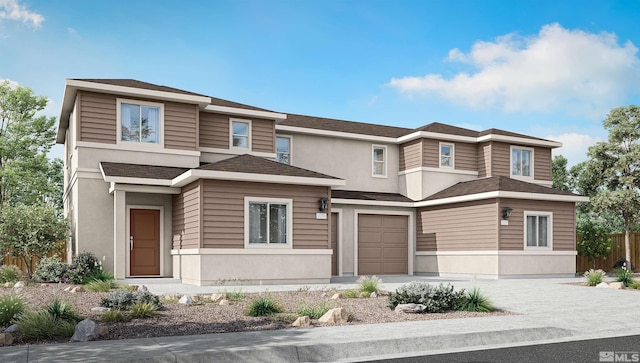 view of front of property featuring fence, driveway, and stucco siding