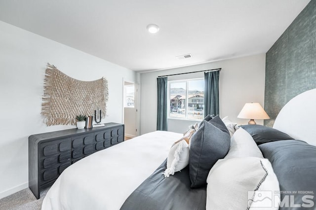 bedroom with visible vents, baseboards, and carpet floors