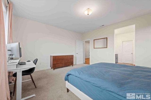 carpeted bedroom featuring visible vents and baseboards