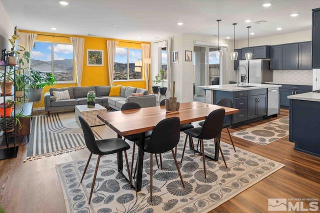 dining area featuring recessed lighting and dark wood finished floors