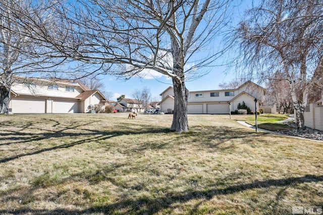 view of yard with a garage