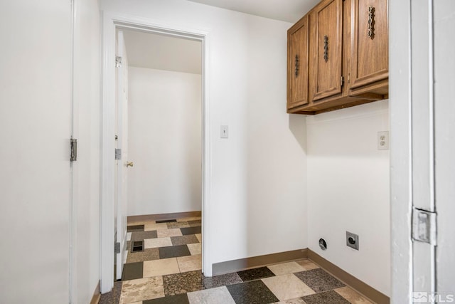 laundry room featuring tile patterned floors, cabinet space, baseboards, and hookup for an electric dryer