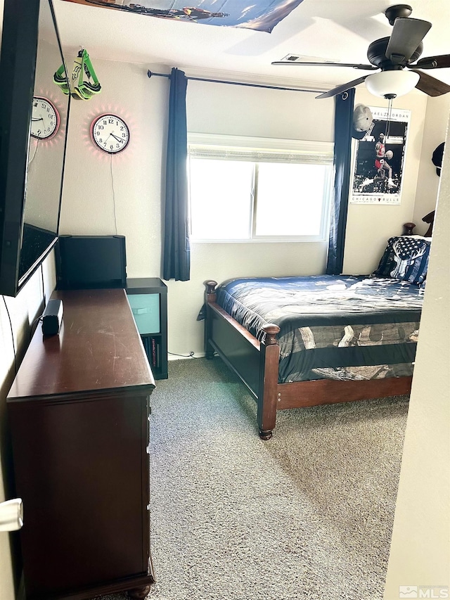 carpeted bedroom with a ceiling fan