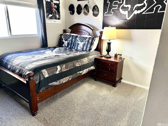 carpeted bedroom with baseboards