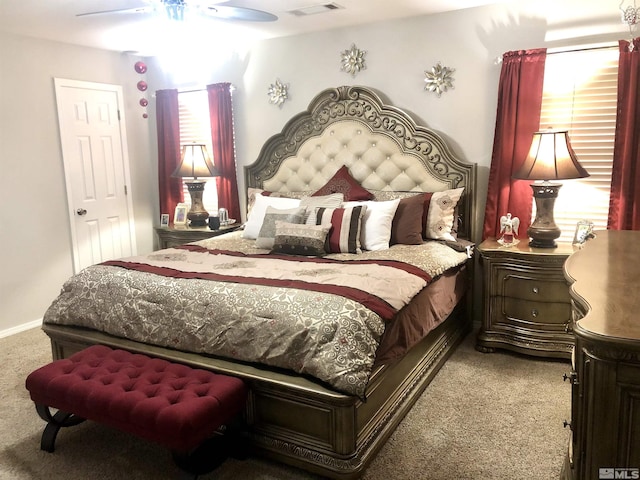 bedroom featuring a ceiling fan, baseboards, visible vents, and carpet floors