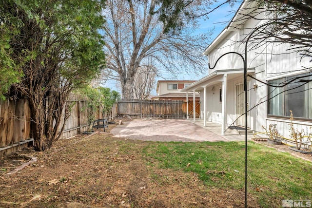 view of yard featuring a fenced backyard and a patio area