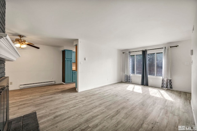 unfurnished living room with a brick fireplace, ceiling fan, baseboards, light wood-style floors, and a baseboard radiator