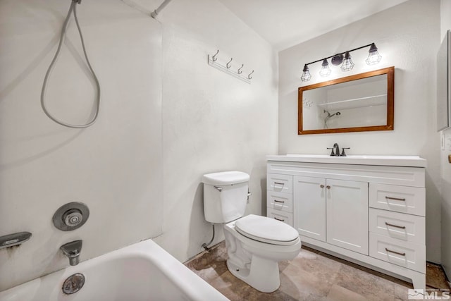 bathroom featuring toilet, vanity, and bathtub / shower combination