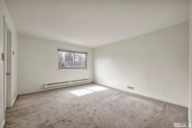 unfurnished room featuring a baseboard heating unit, baseboards, carpet, and visible vents