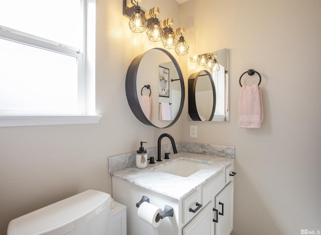 half bath with toilet and vanity