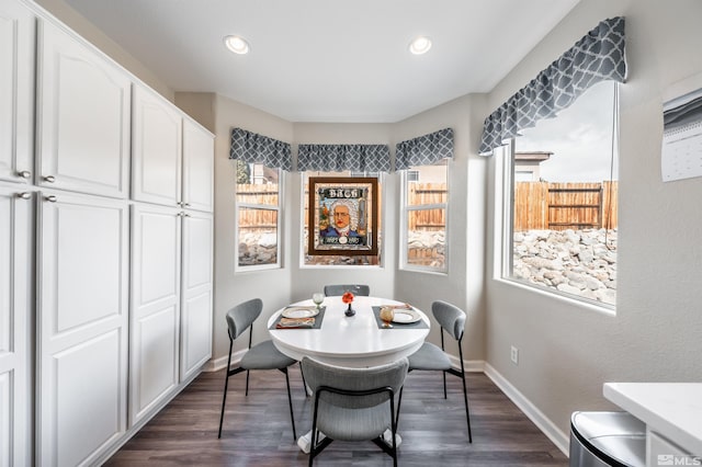 dining space with dark wood finished floors, recessed lighting, and baseboards