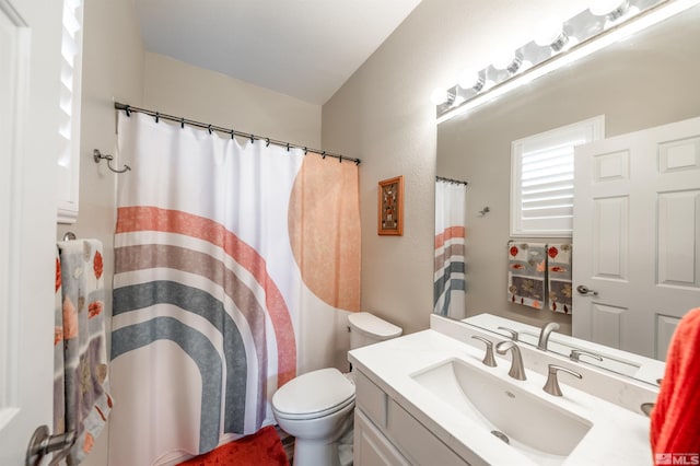 full bathroom with vanity, toilet, and a shower with curtain