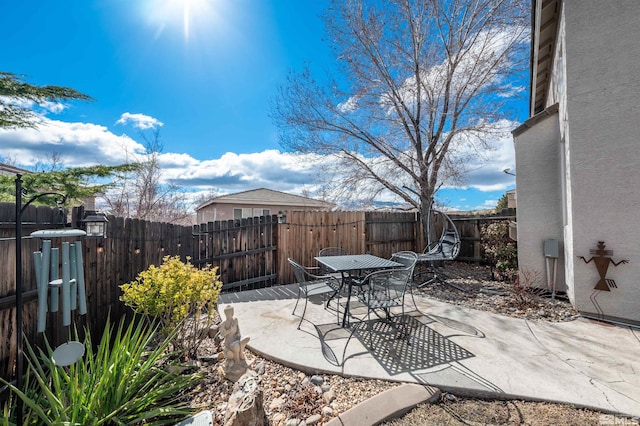 view of patio / terrace with outdoor dining space and a fenced backyard