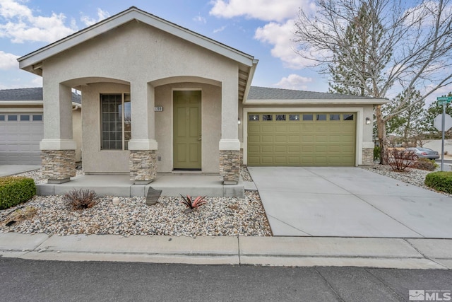 view of front facade with a garage, stone siding, and stucco siding