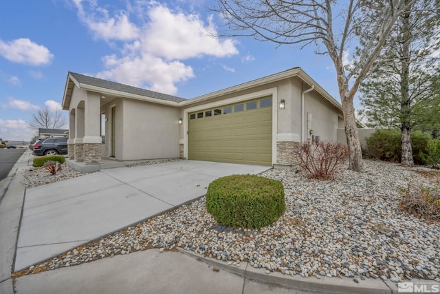 view of side of home featuring stone siding, stucco siding, an attached garage, and driveway