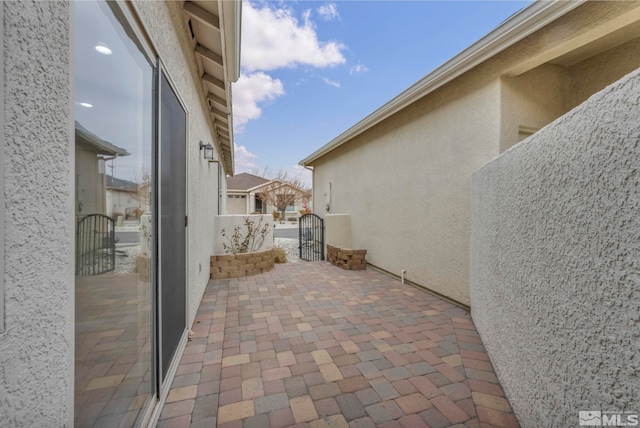 view of patio / terrace with a gate