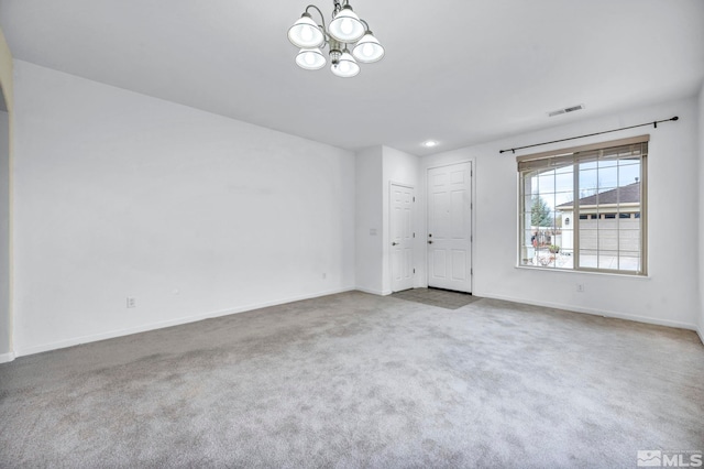 interior space with a notable chandelier, visible vents, carpet flooring, and baseboards