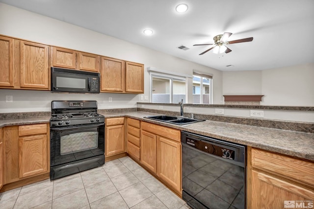 kitchen featuring a ceiling fan, visible vents, light tile patterned flooring, a sink, and black appliances