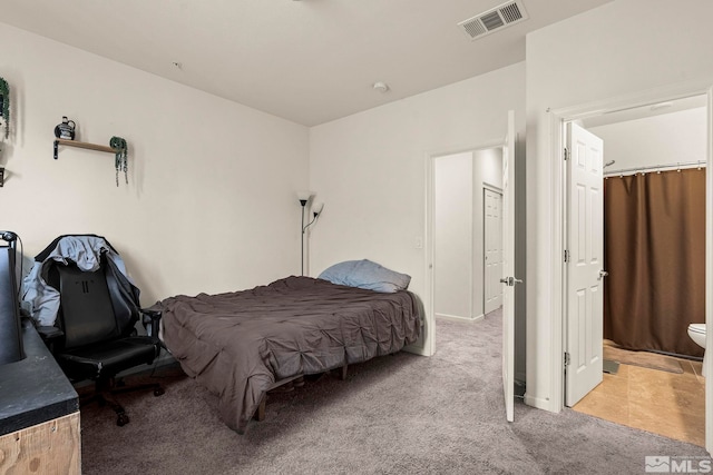 bedroom with visible vents and carpet floors