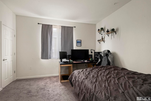 carpeted bedroom with baseboards