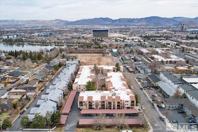 aerial view featuring a water and mountain view