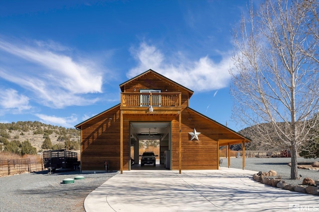 view of front of house with fence and a mountain view