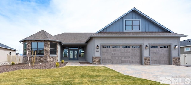 view of front of house featuring stone siding, board and batten siding, and fence