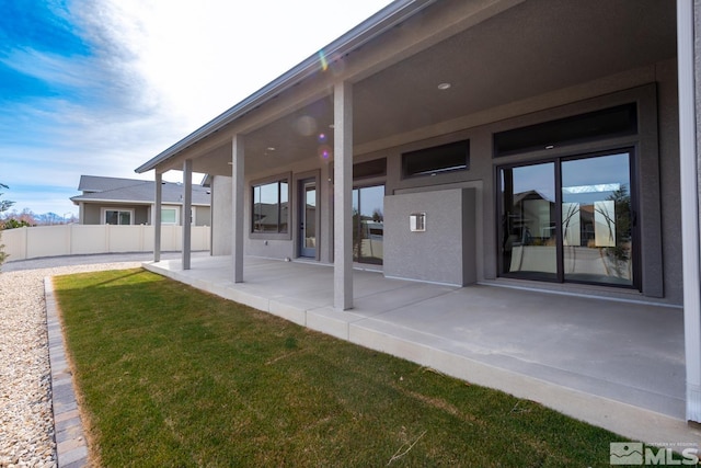 exterior space featuring a patio area and fence