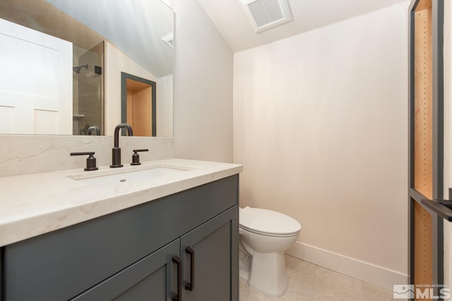 full bath with vanity, visible vents, baseboards, a walk in shower, and toilet