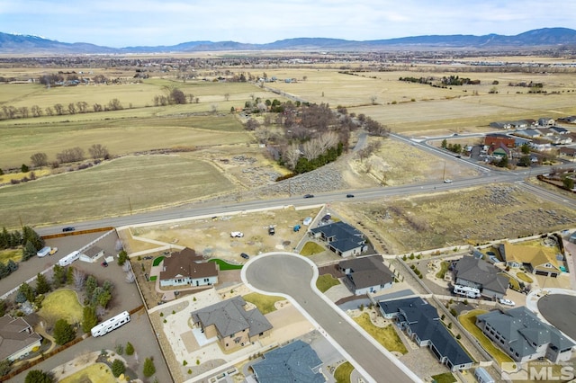 drone / aerial view featuring a mountain view