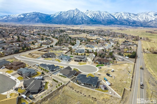 drone / aerial view with a residential view and a mountain view