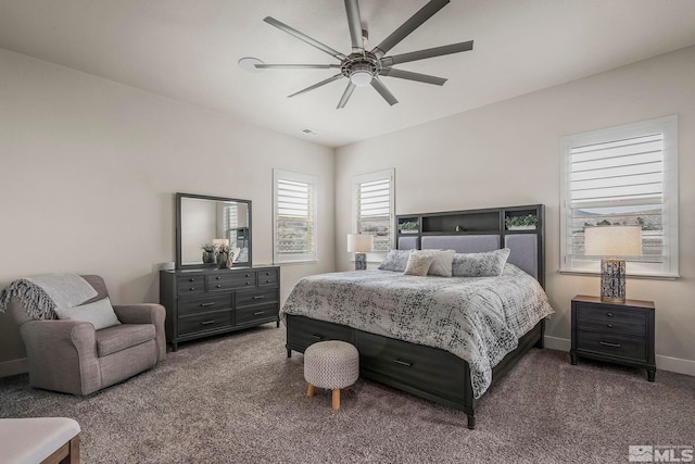 carpeted bedroom featuring visible vents, ceiling fan, and baseboards