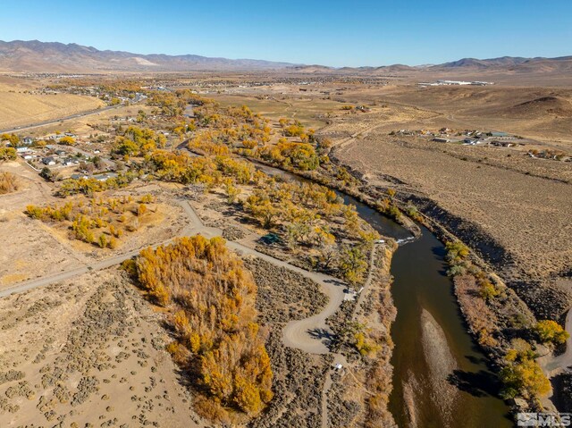 birds eye view of property featuring a mountain view