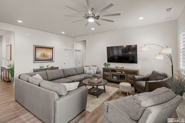 living room featuring recessed lighting, visible vents, light wood-style floors, and ceiling fan