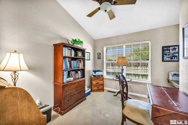 office space featuring visible vents, baseboards, carpet, vaulted ceiling, and a ceiling fan