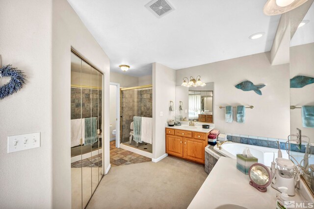 full bathroom with vanity, a bath, visible vents, and a stall shower