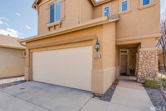 exterior space with concrete driveway