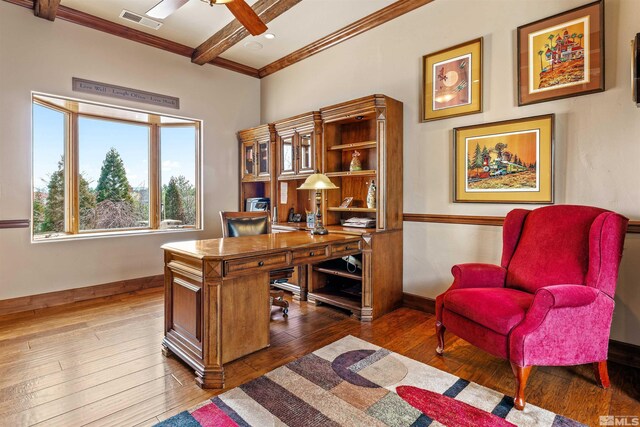 office area featuring baseboards, visible vents, ceiling fan, hardwood / wood-style flooring, and beamed ceiling