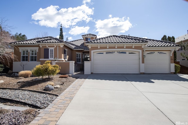 mediterranean / spanish home with an attached garage, stucco siding, concrete driveway, a fenced front yard, and a tile roof