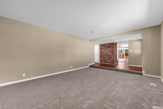 unfurnished living room with visible vents, baseboards, and carpet floors