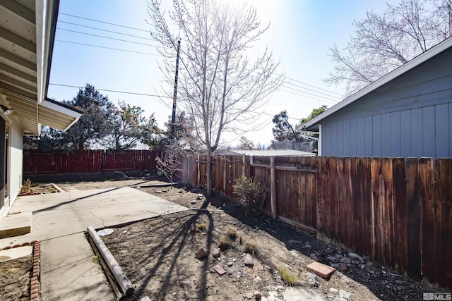 view of yard with a patio and a fenced backyard