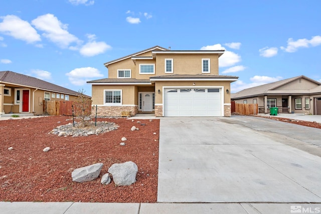 view of front of house featuring stucco siding, stone siding, fence, concrete driveway, and a garage