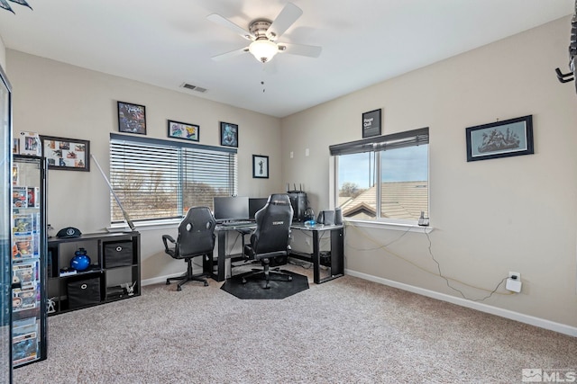 carpeted home office featuring visible vents, plenty of natural light, and baseboards