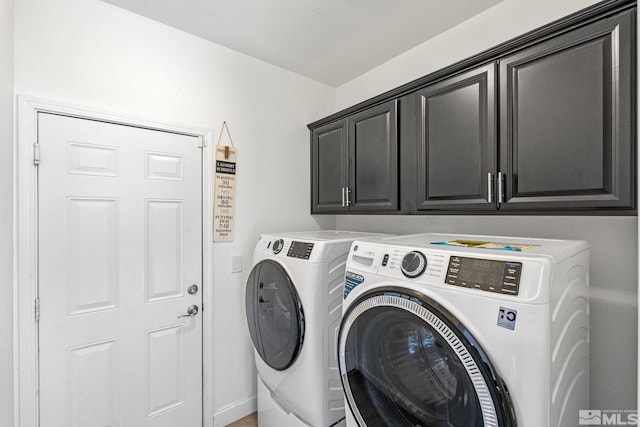 laundry area featuring cabinet space and independent washer and dryer