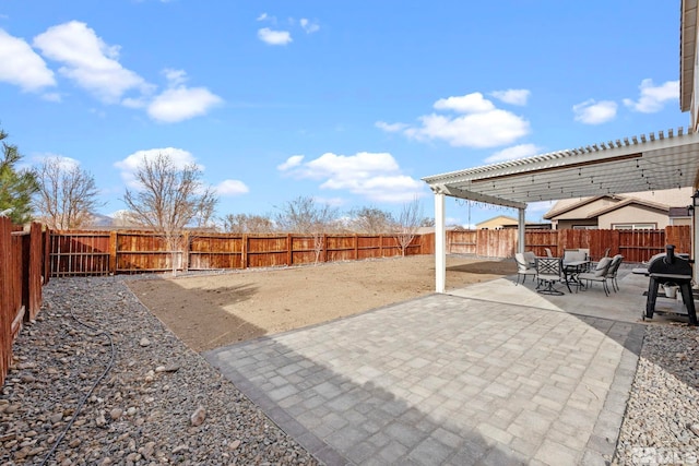 view of yard with a patio, a fenced backyard, and a pergola