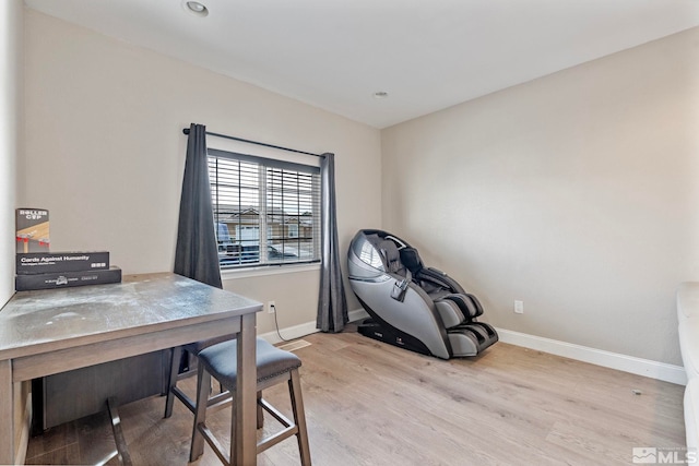 office featuring wood finished floors and baseboards