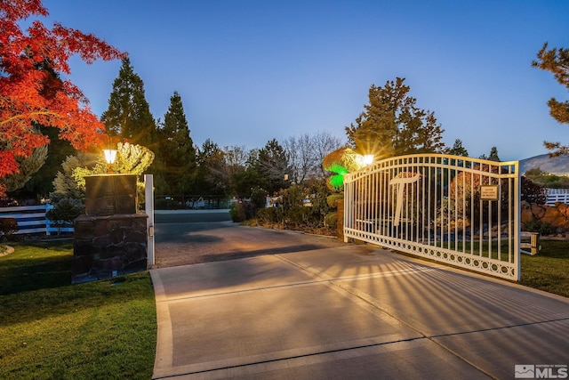 view of gate featuring fence